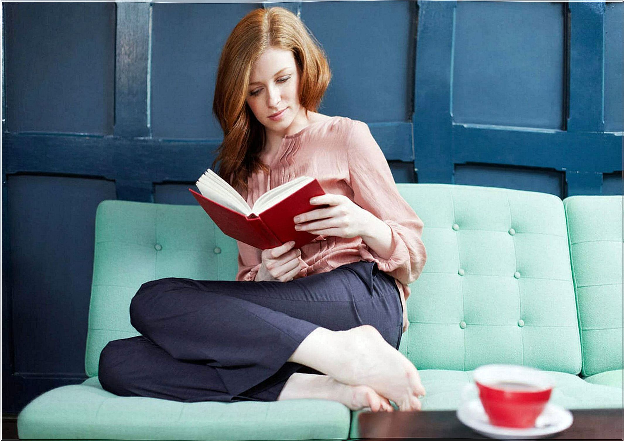 woman reading on the couch