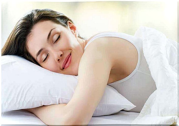 smiling woman in bed